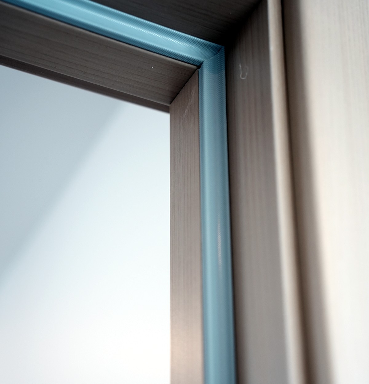 Upper detail of ORI door frame with acoustic sealing strip