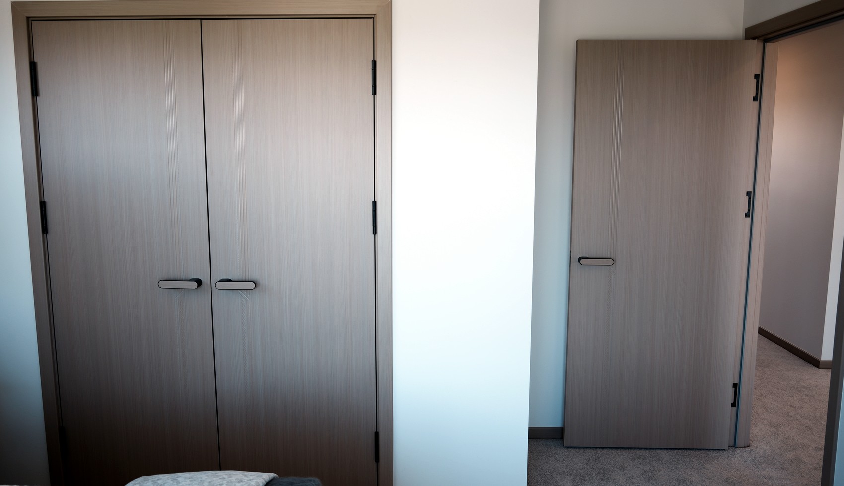 ORI pre-finished doors installed in a bedroom with matching door finishes