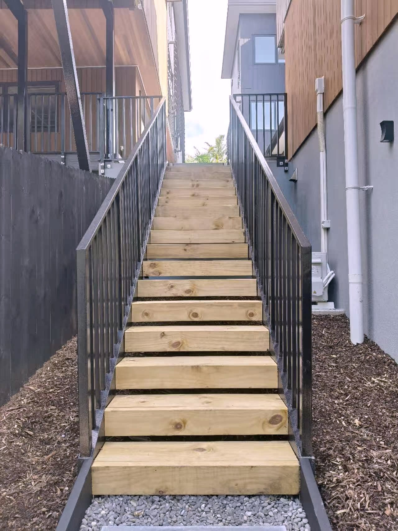 Completed ORI outdoor stair with steel balustrade and timber treads